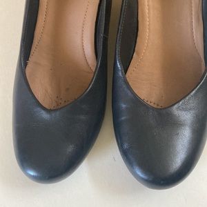 Black wedge heels by Clark’s